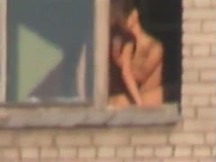 By the window, my ally was beating his girlfriend.